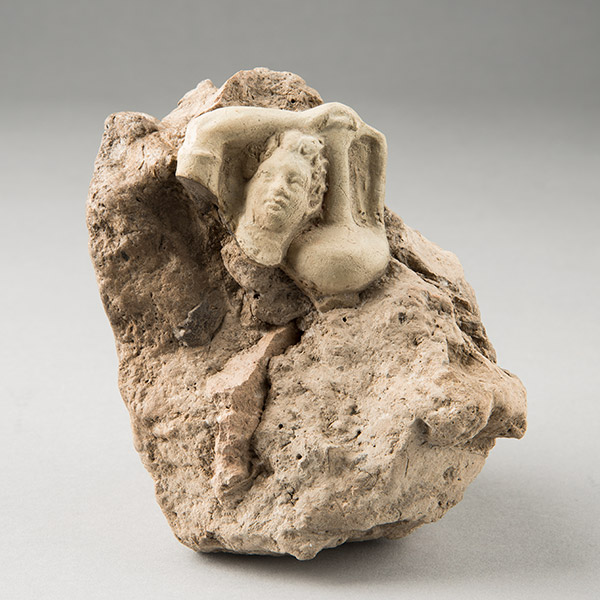 Figurine of a boy carrying a jar