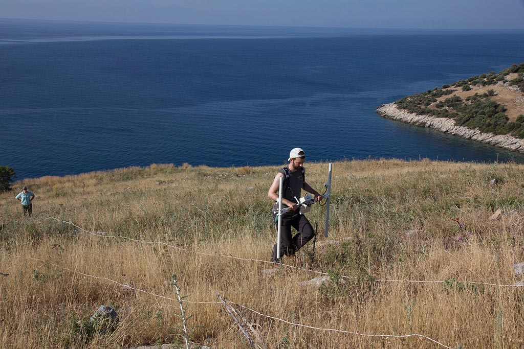 Archaeologists carrying out geophysical survey